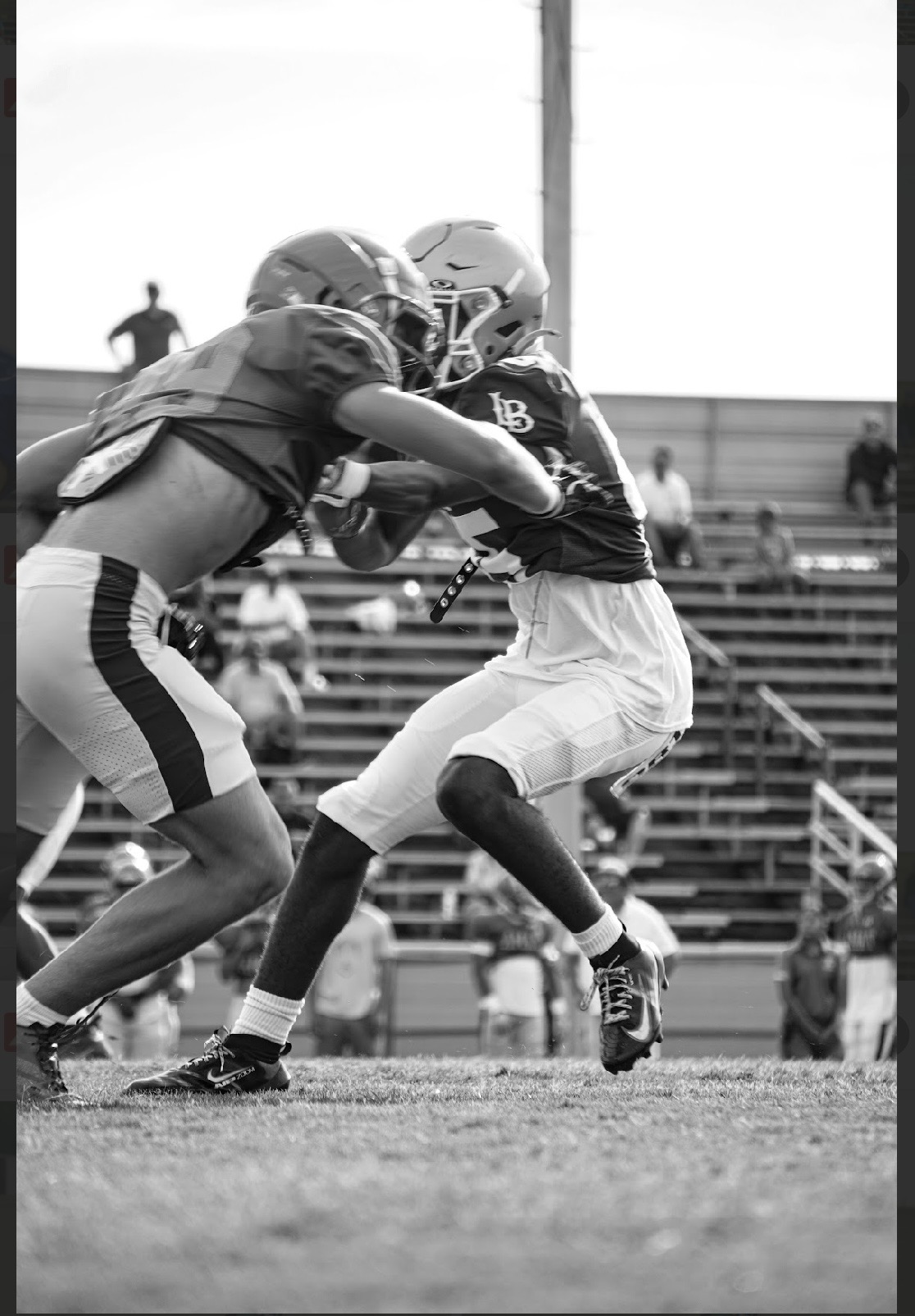 Ezra Rane Woodard making contact during a football play